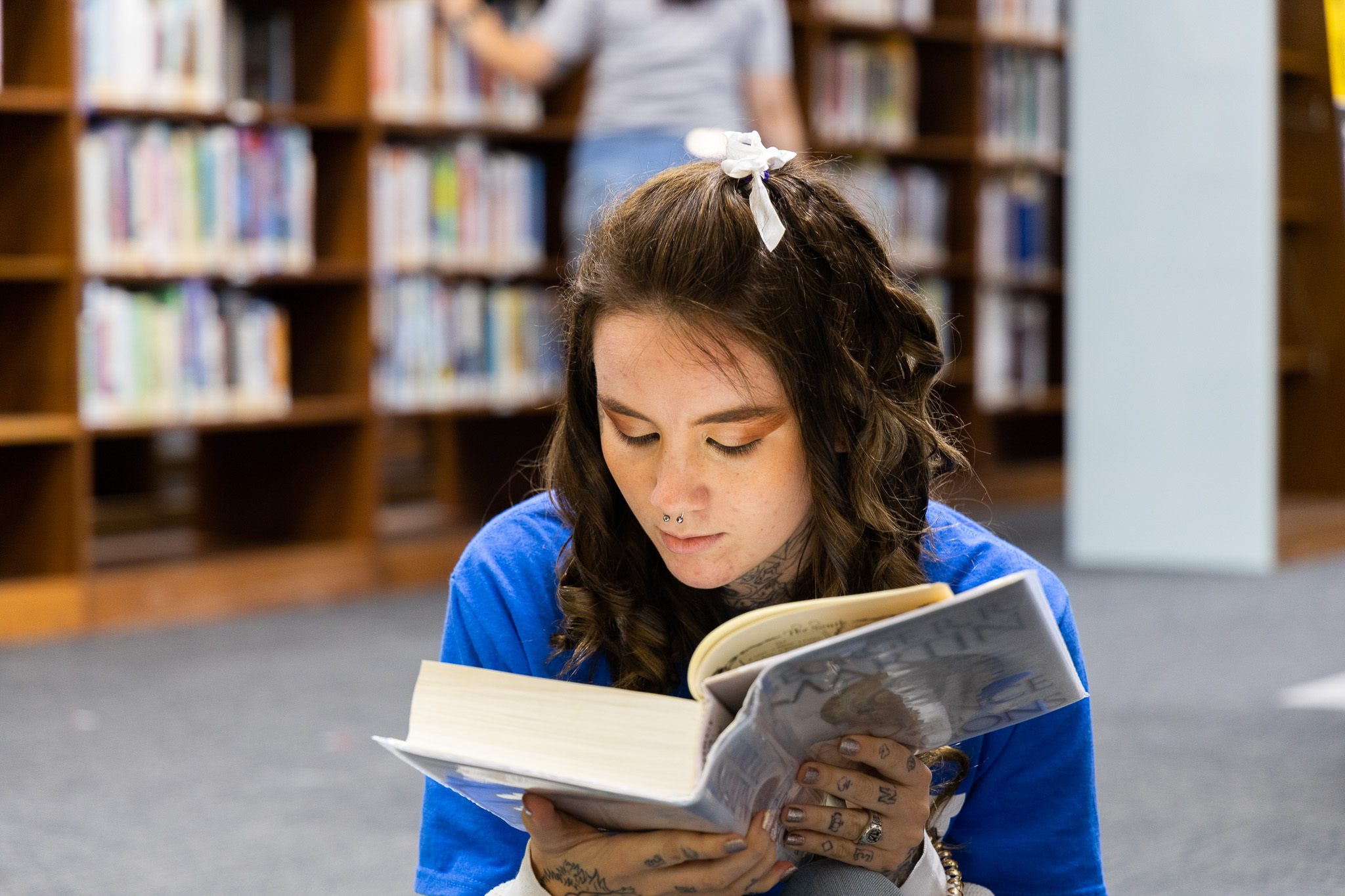 Student reading in the library