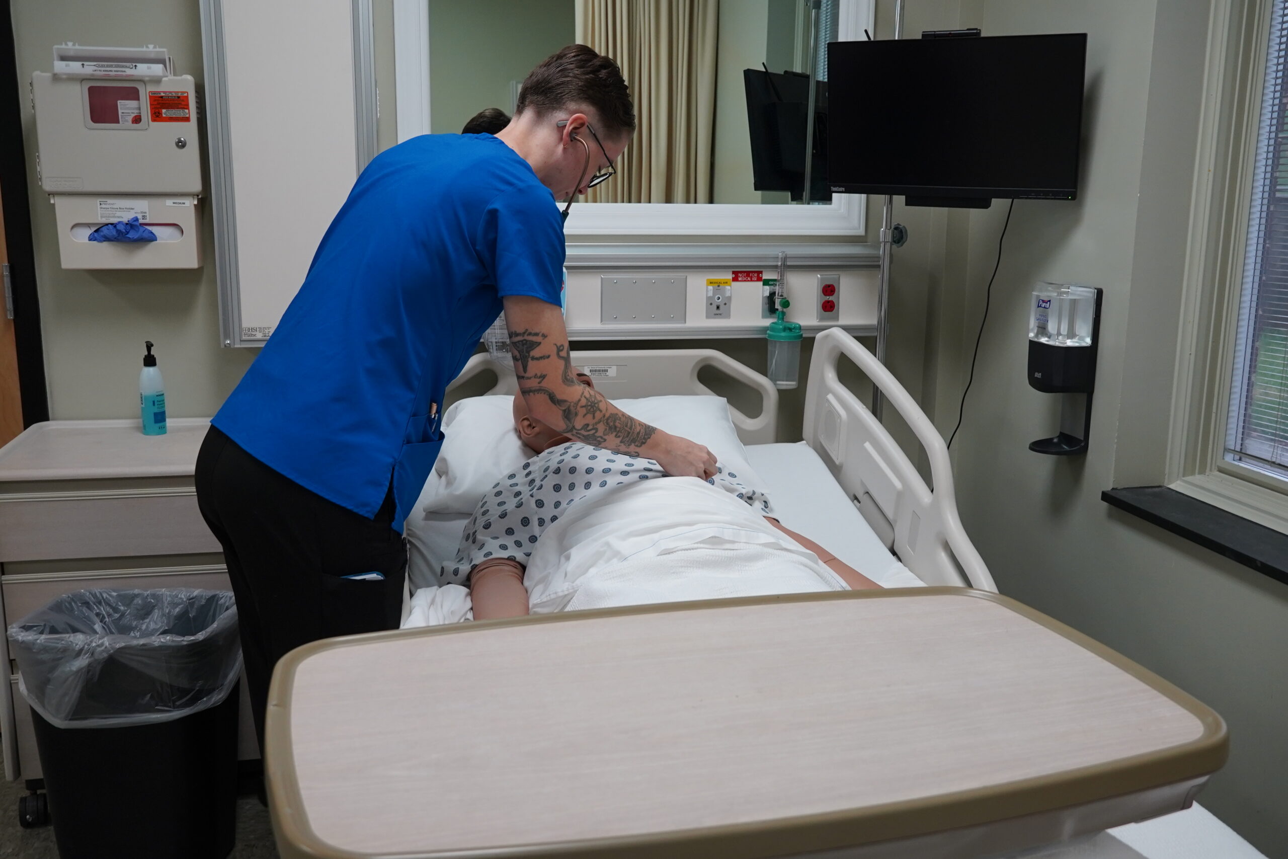 Mallory practices her skills in the nursing simulation lab.