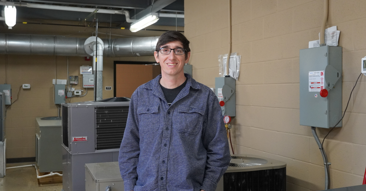Matthew Pasley poses in the HVAC lab.